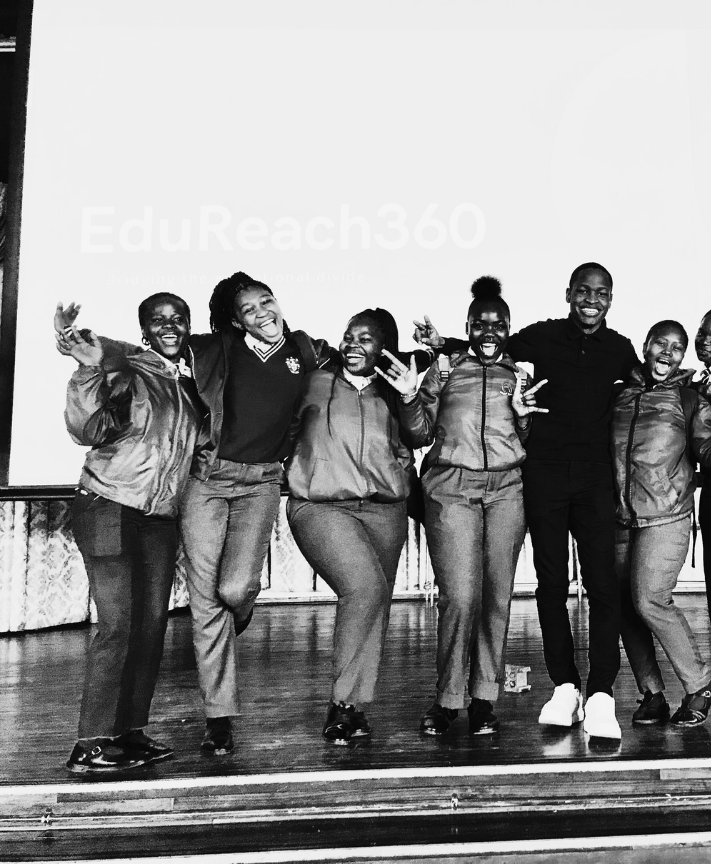EduReach360 learners celebrating on stage after a school session